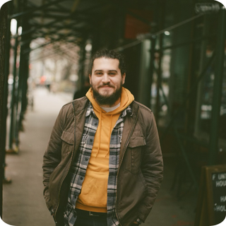 Elliot Davis standing under scaffolding. 