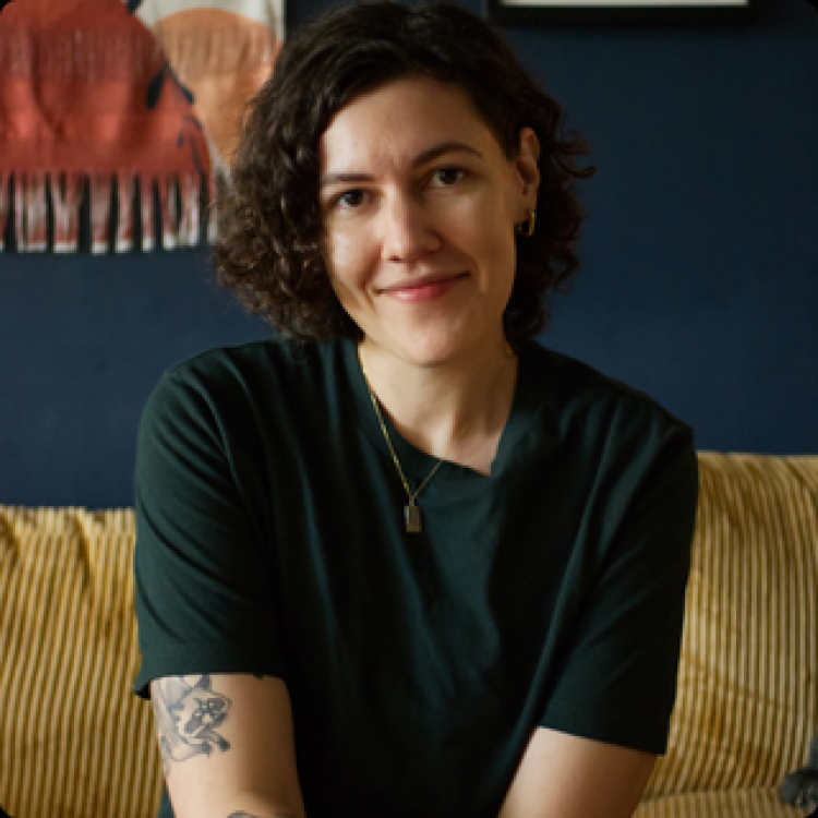 J Strautman sitting on a couch. 